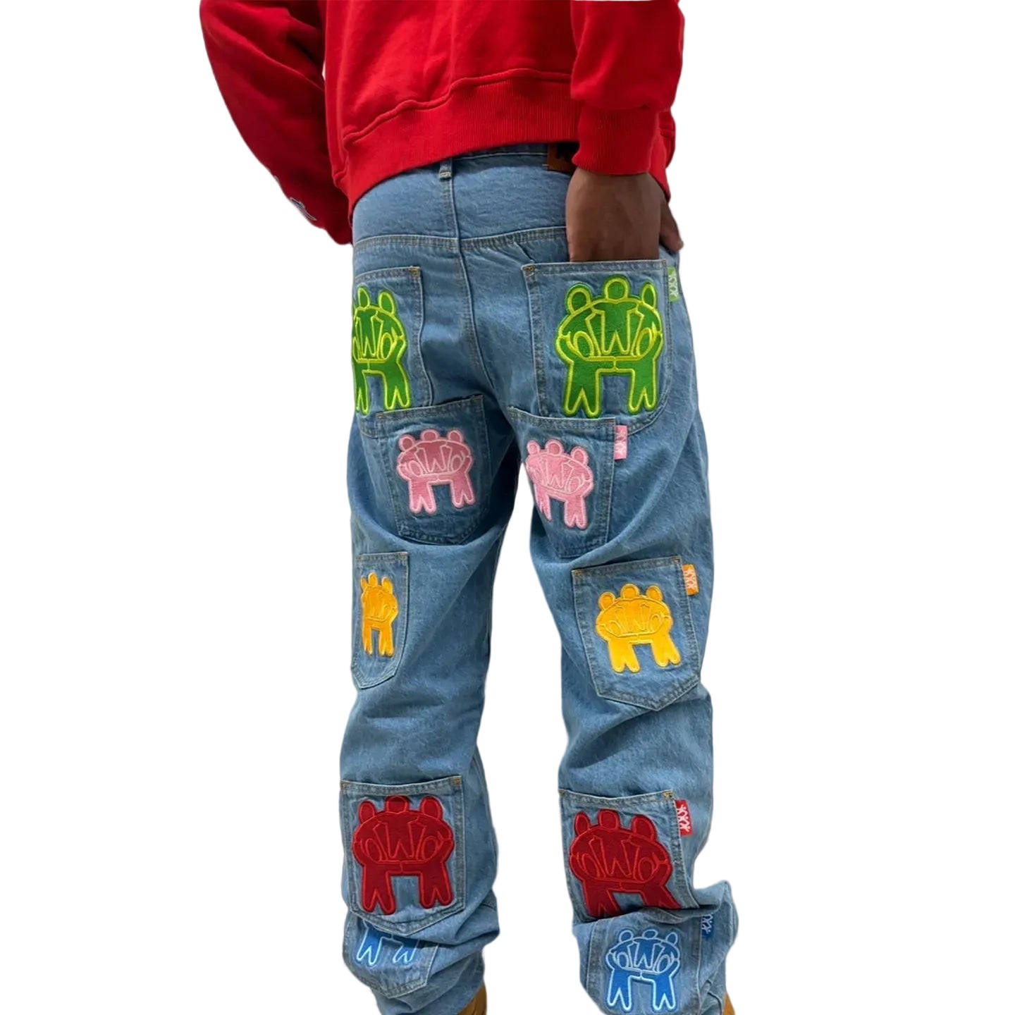 Blue jeans with colorful patches on a white background